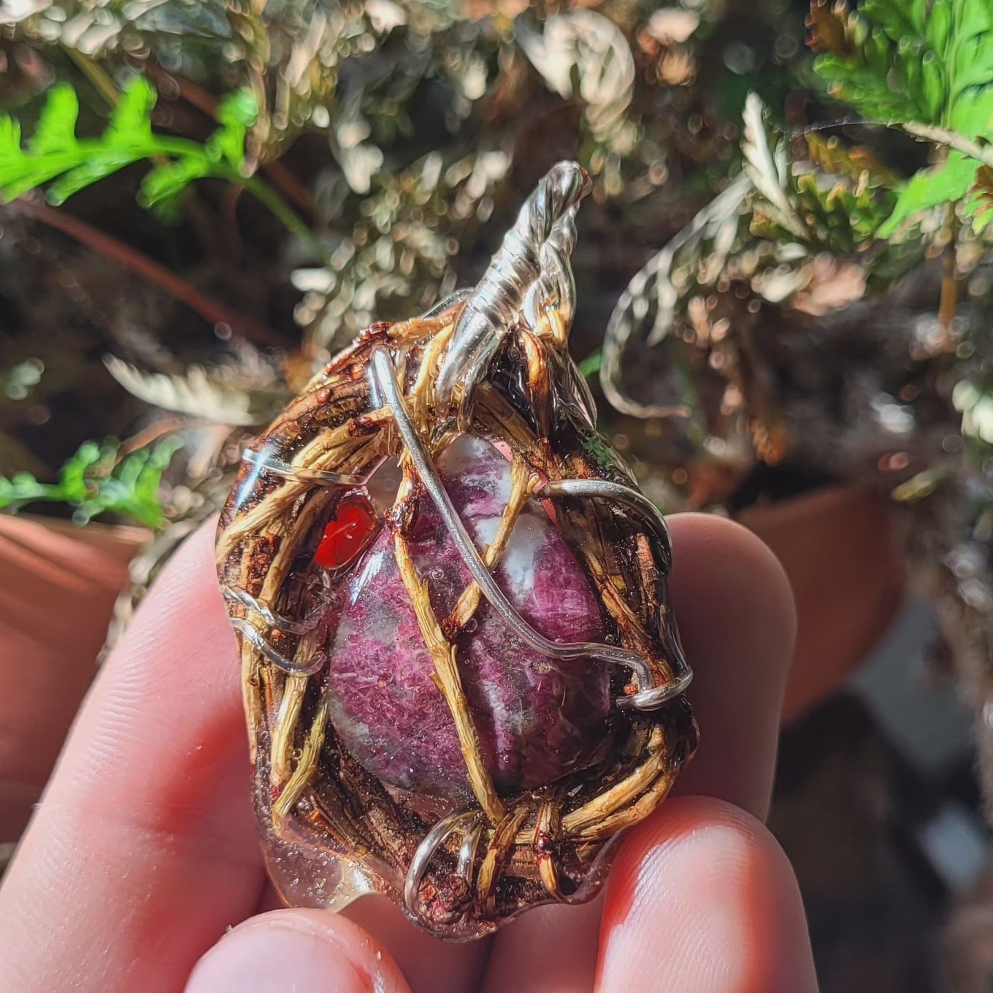 A Silver and Yew Nested Rubalite and Sun Stone